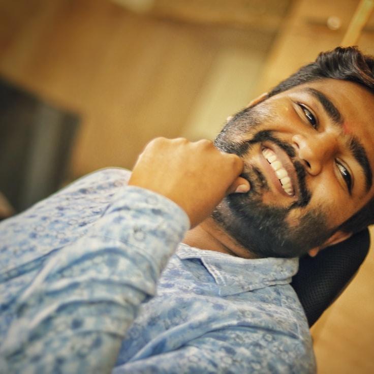 Aisha Rao, Lead Design Curator at Solid Carry Still, reviewing corporate floral arrangements